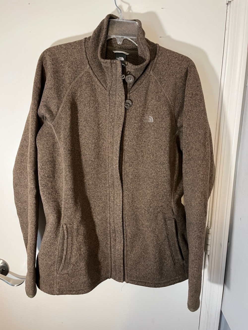 North Face women’s light weight sweater with zip front size XLarge color brown.